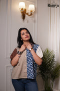 Blue Loom Shirt Top featuring a half-and-half patchwork design with beige cotton and indigo diamond block prints, styled with a tan sleeve and structured collar.