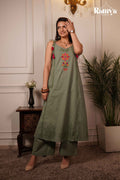 Model posing in an olive sage tie-shoulder A-line tunic paired with wide-leg pants from the Ramya Studio Gulaal-on-Green ethnic set.