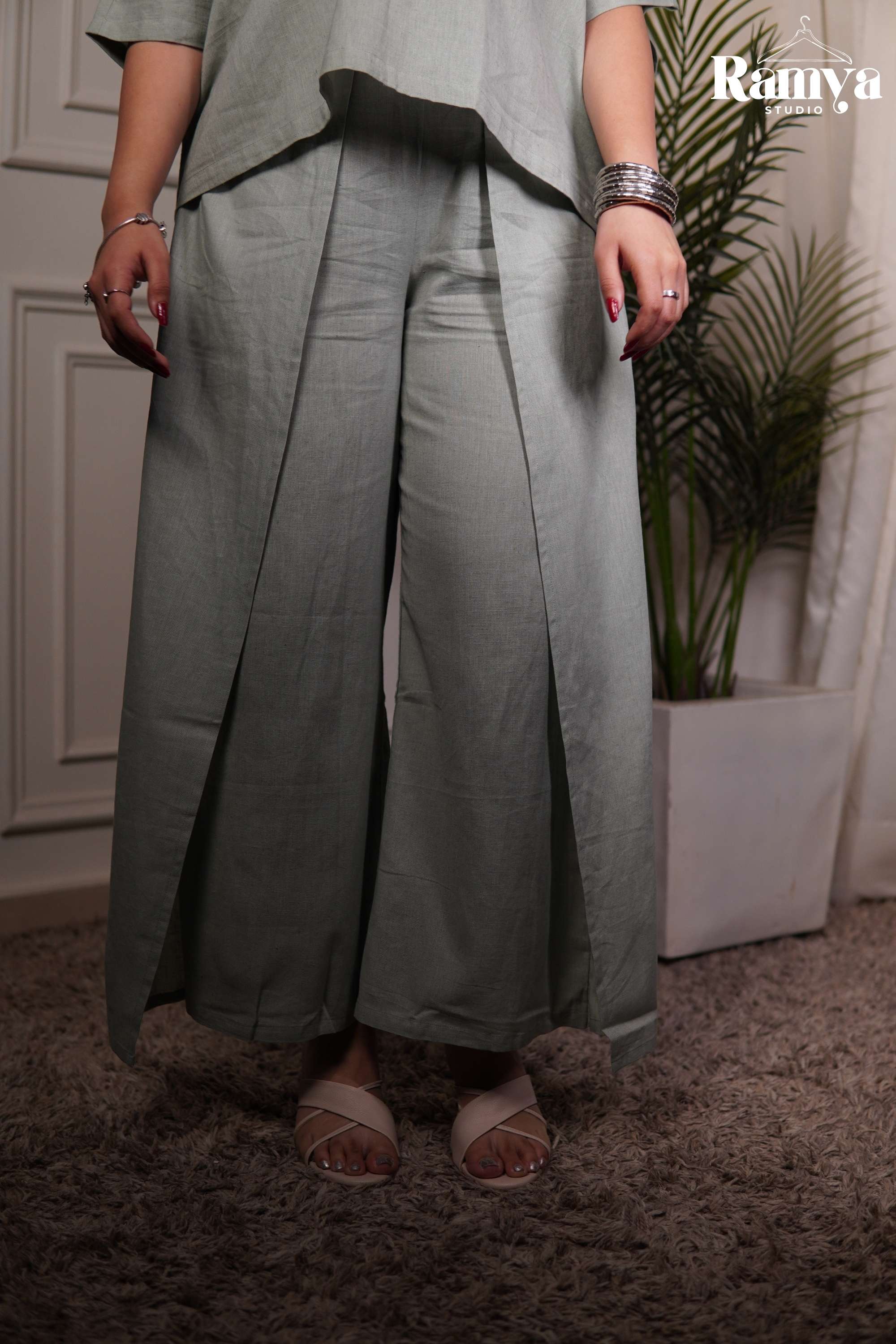 Ramya Studio solid sage green minimalist co-ord set with boxy top and flared wide-leg pants.