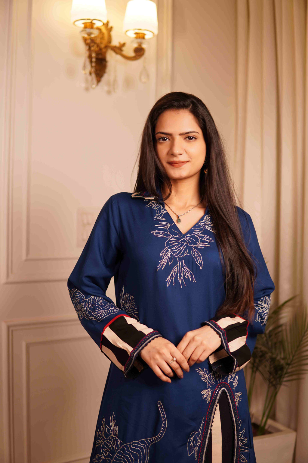 Elegant evening co-ord set for women: A navy blue tiger-print kurta set with striped palazzos, perfect for a modern 'Sherni' look at a boutique event
